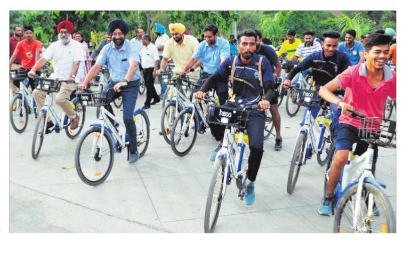 Students and Staff on Bicycle